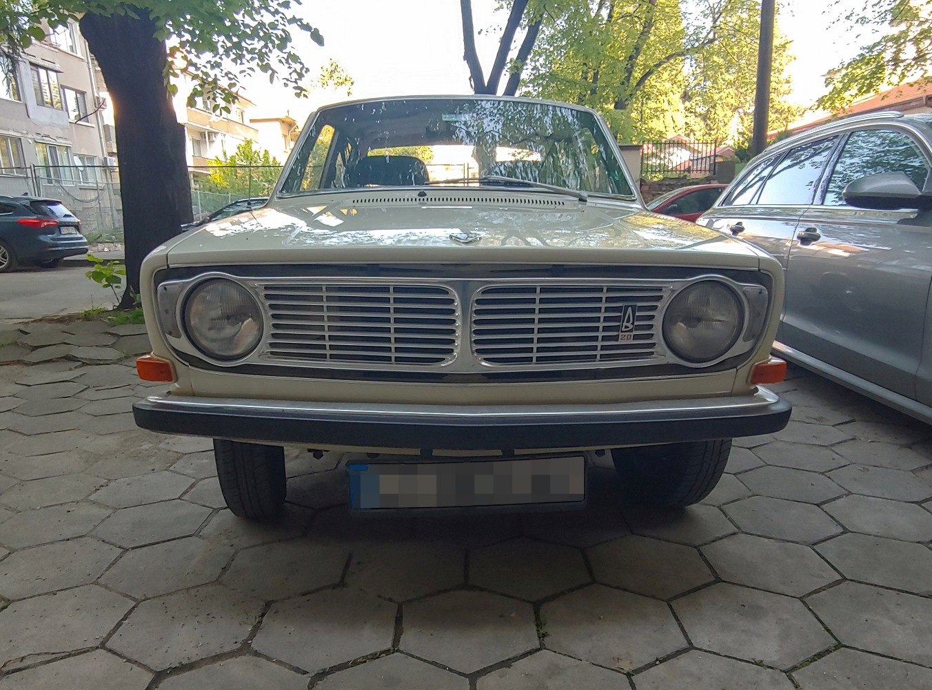 Front grille and round headlights of a classic sedan