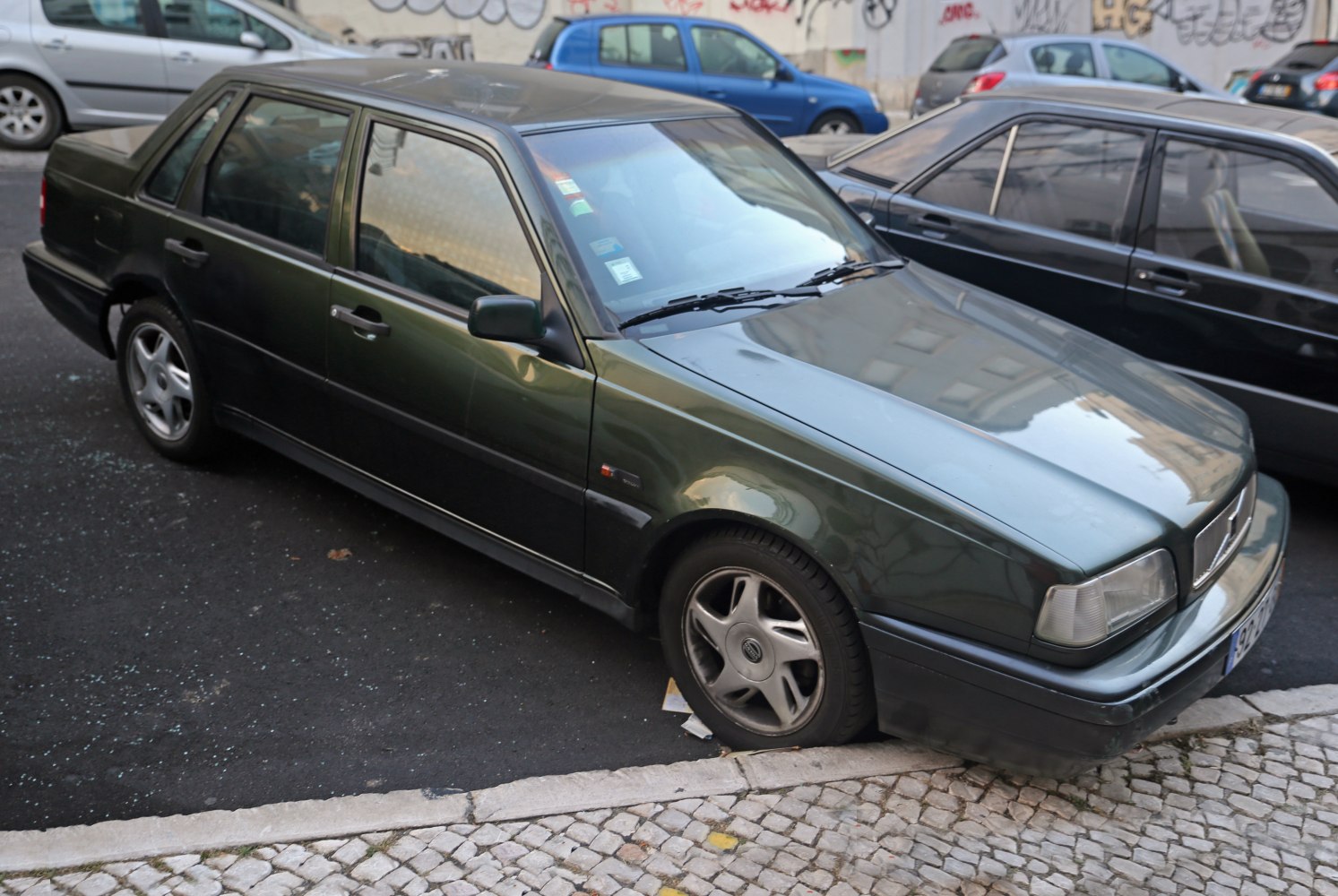 Boxy sedan with alloy wheels and rectangular headlights