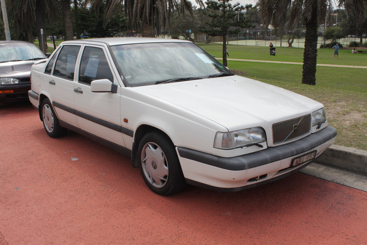 White sedan with classic front grille and black bumper trim