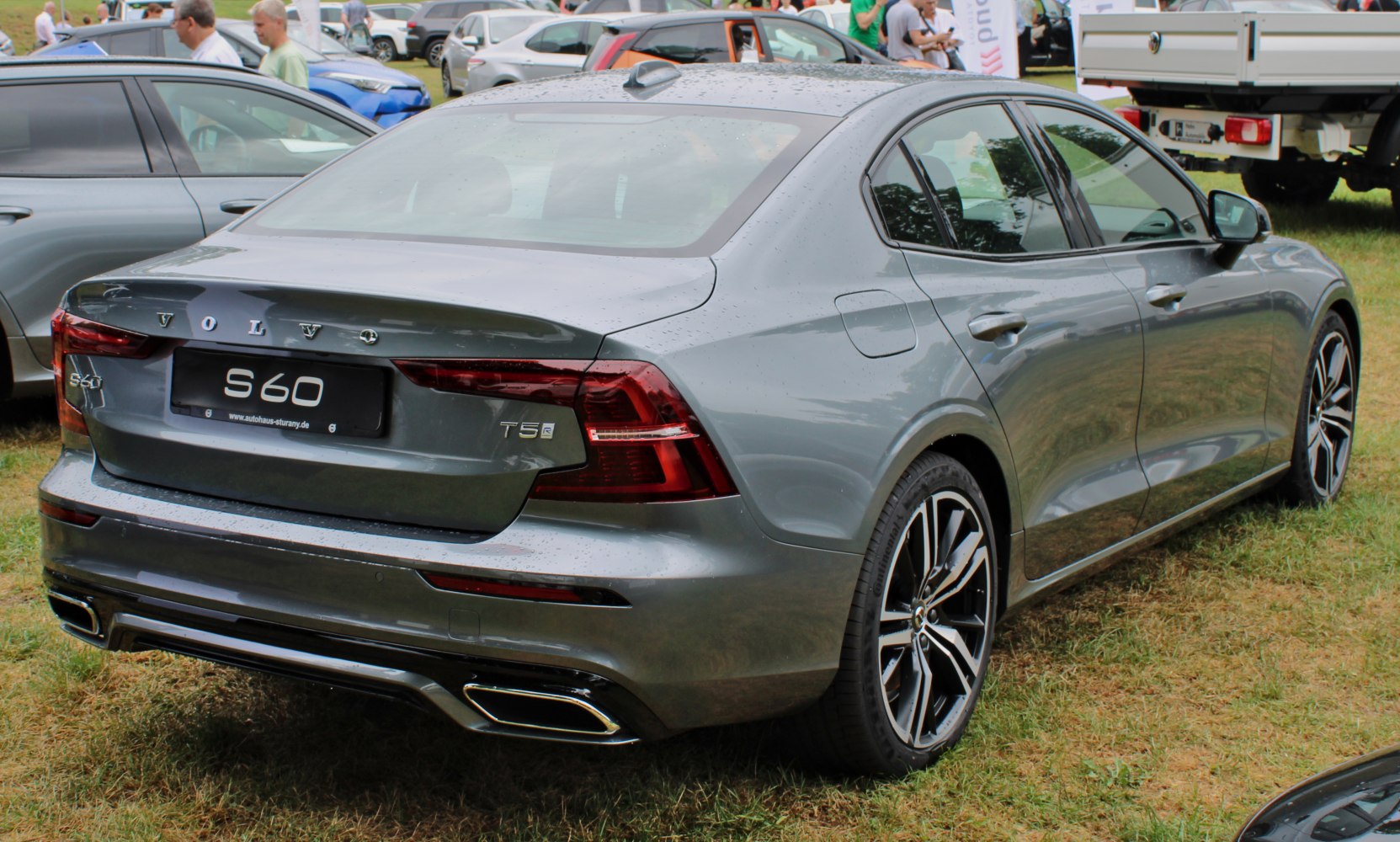 Rear view of a sedan with modern taillights and dual exhaust tips