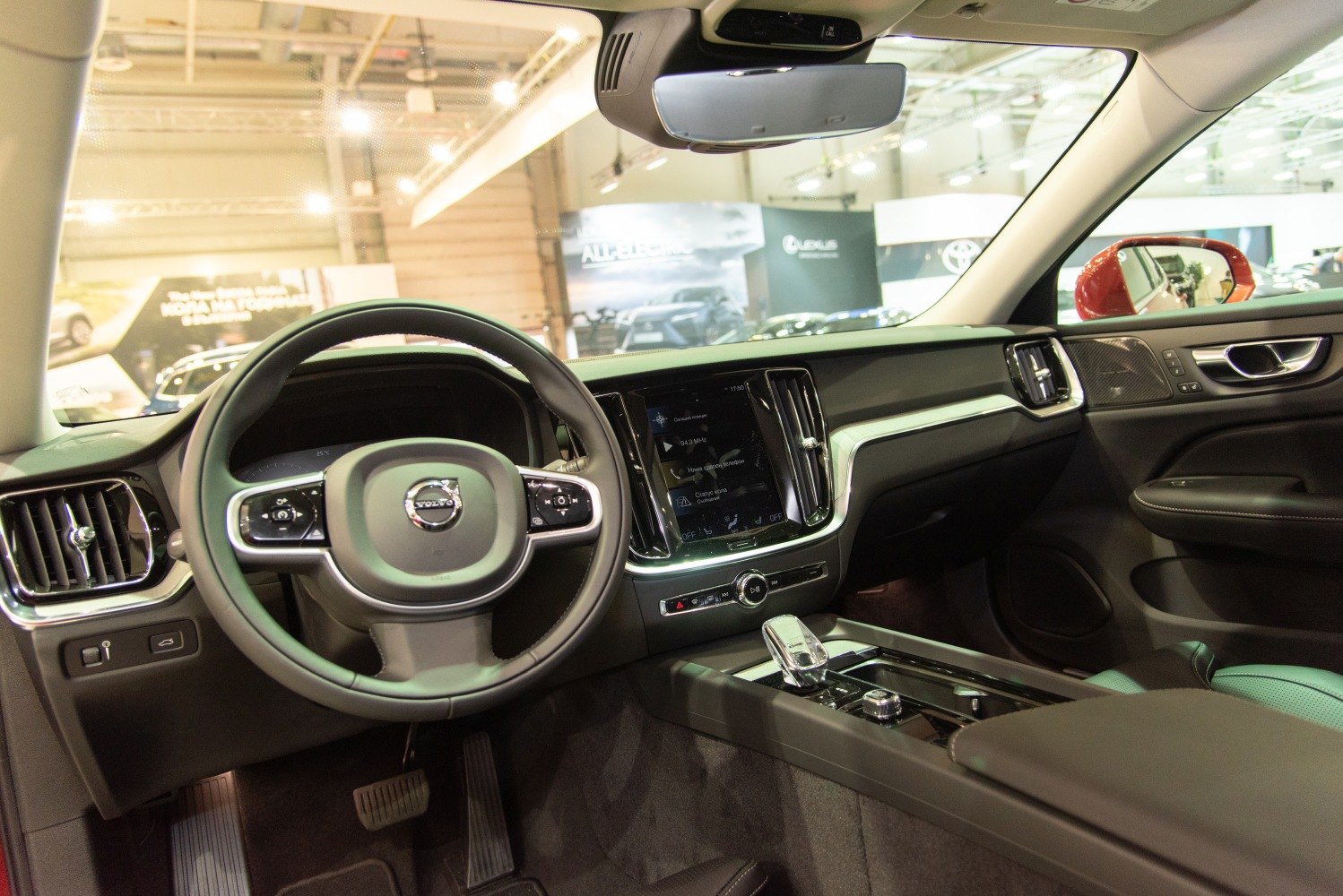 Modern car interior with dashboard, steering wheel, and center console