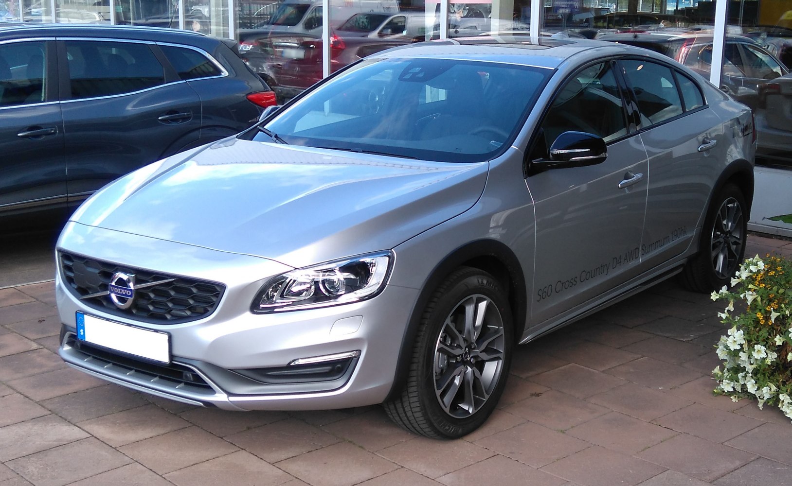 Silver car with LED headlights and rugged wheel arches front view