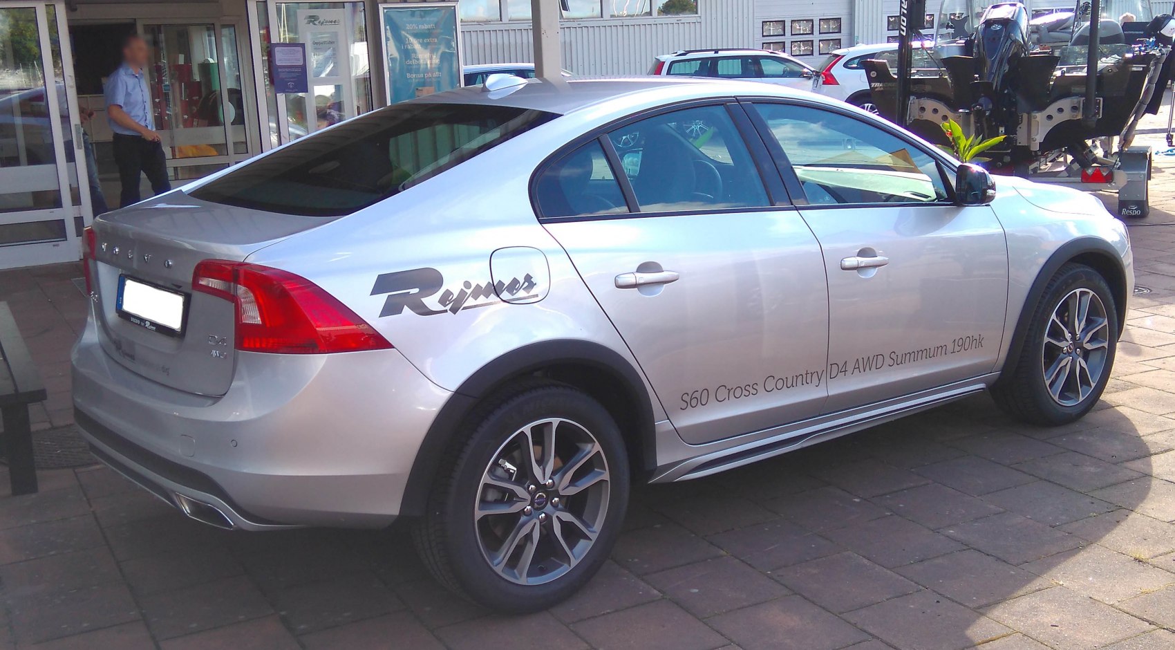 Silver sedan rear side with alloy wheels, AWD, rugged trim