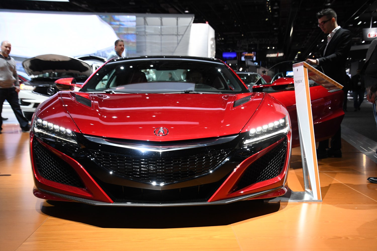 Aggressive front grille and LED headlights with aerodynamic hood vents.