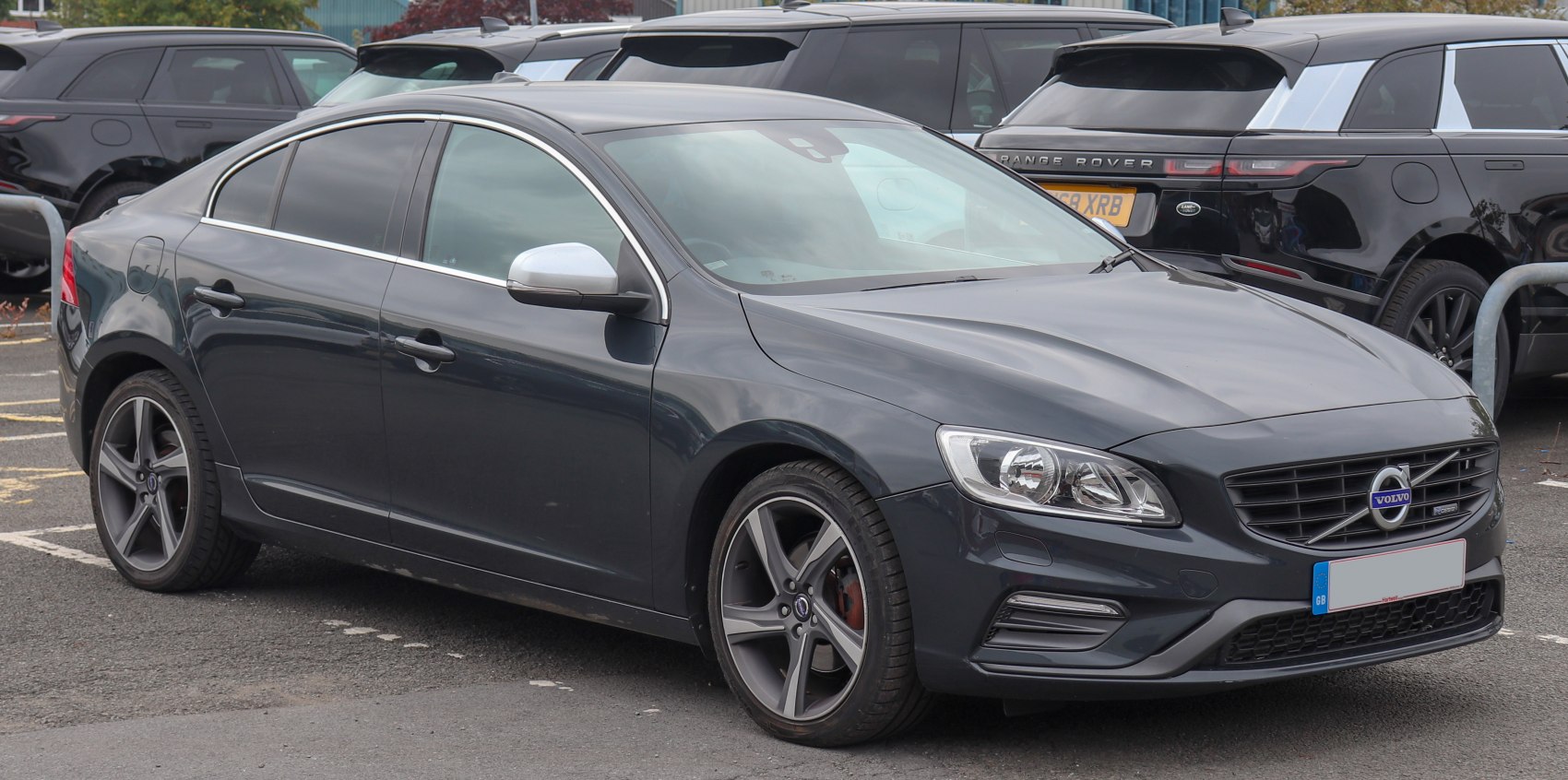 Sporty sedan showing front and side with alloy wheels and tinted windows