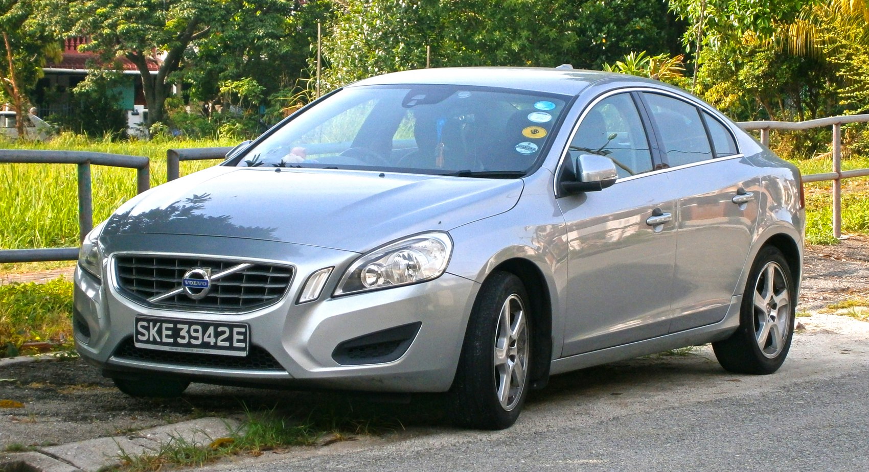 Front and side view of silver mid-size sedan with alloy wheels