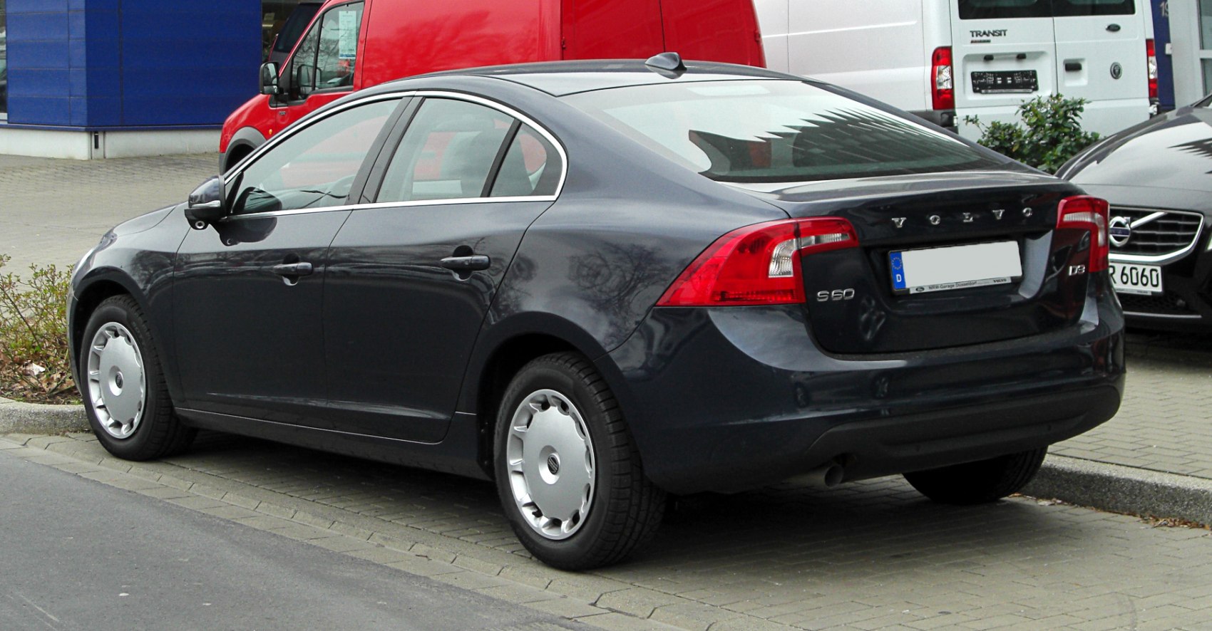 Rear-side view of sedan with distinctive rear lights and smooth body design