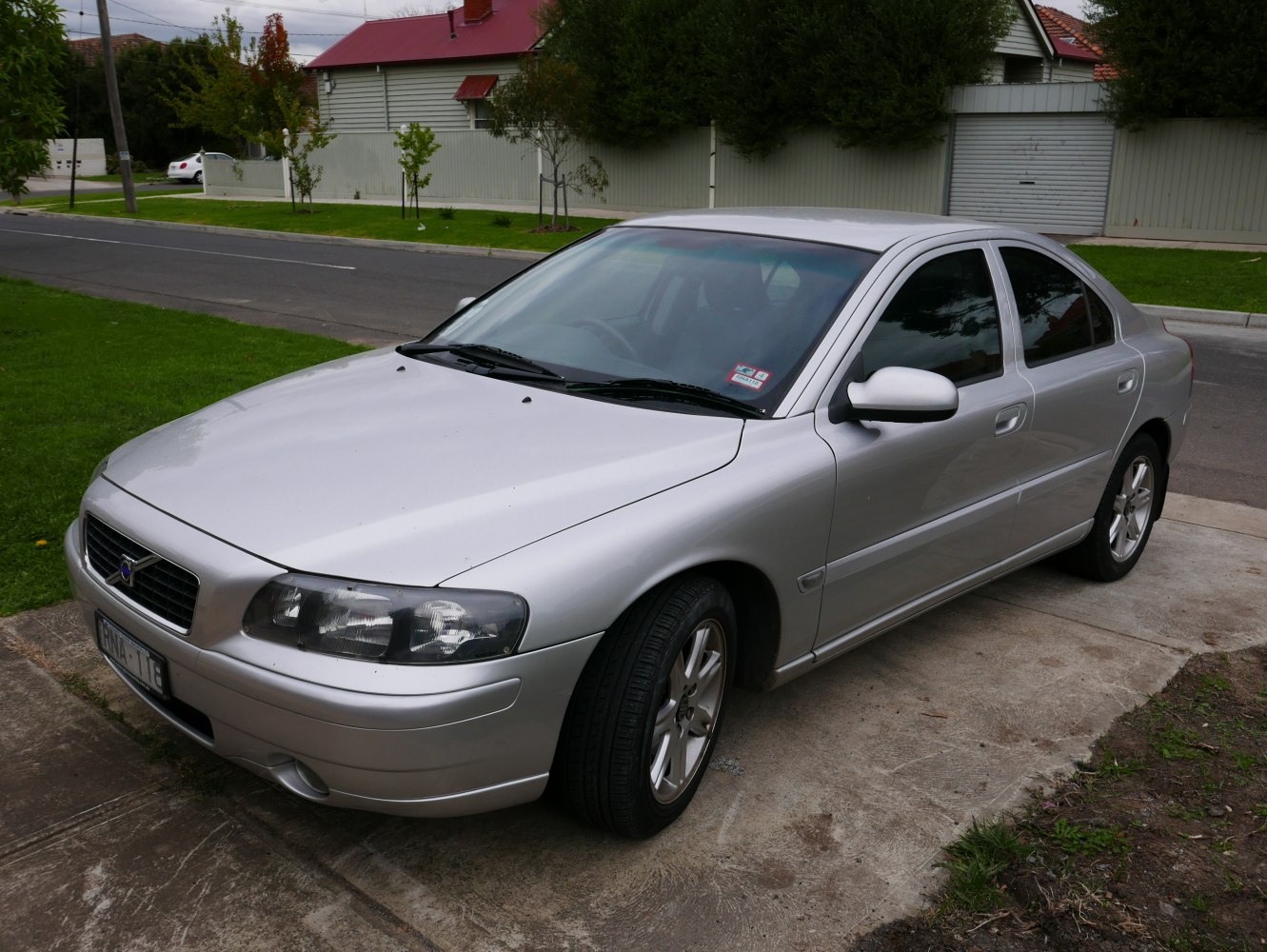 Silver sedan showing front and side view with alloy wheels