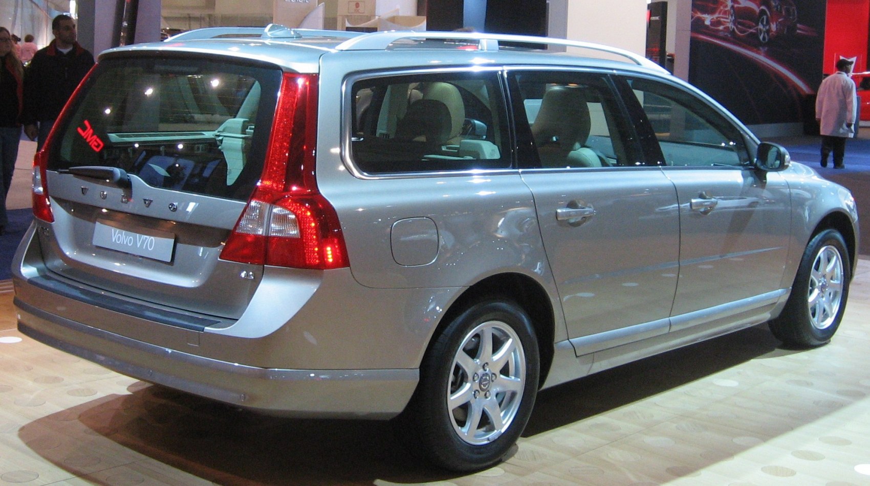 Silver station wagon rear view with roof rails and distinctive tail lights
