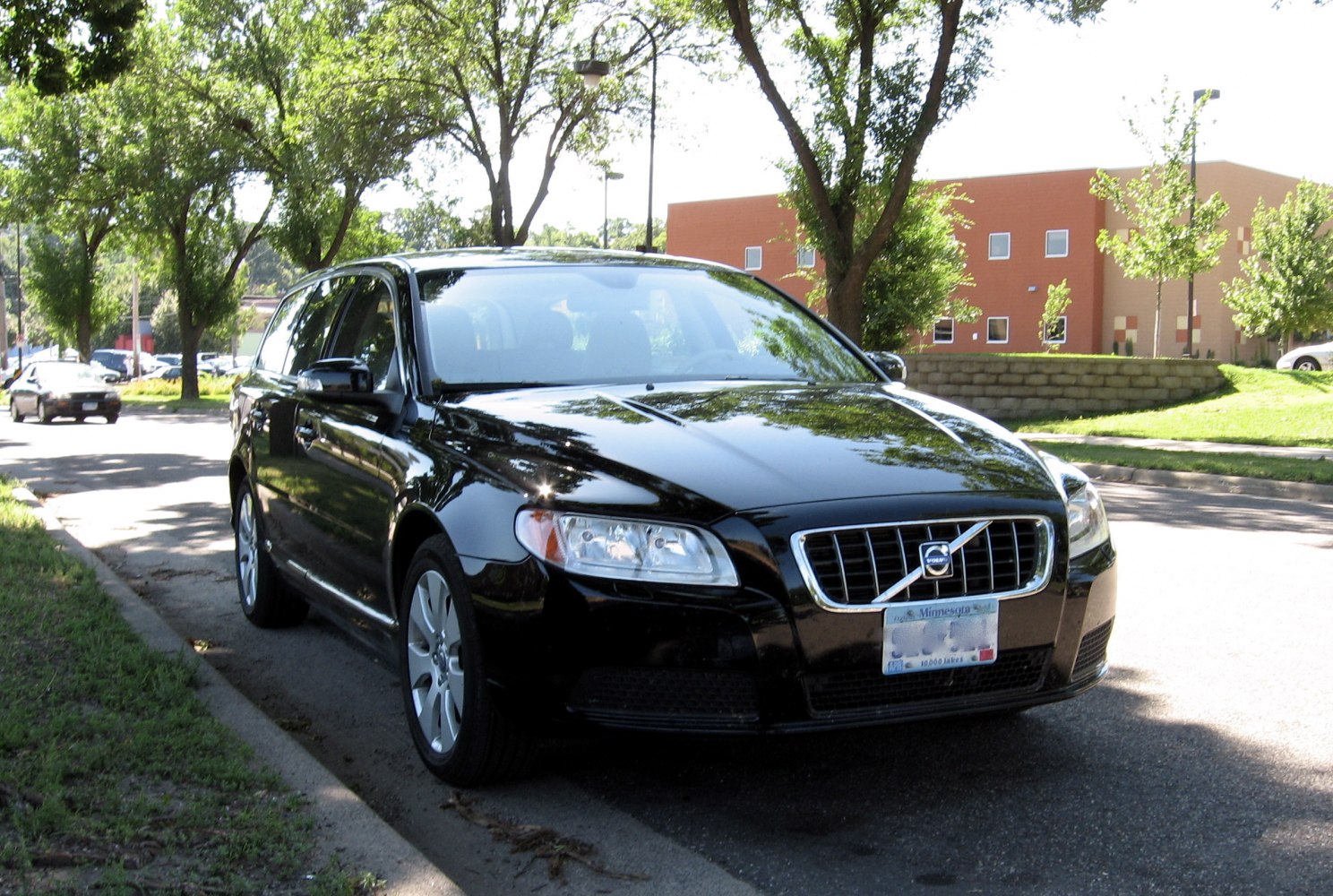 Front view of a black luxury wagon with prominent grille and headlights