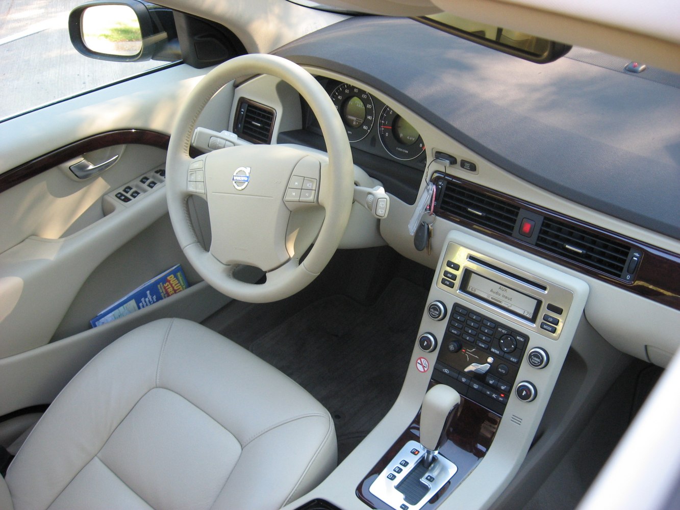 Beige interior with dashboard, steering wheel, and center console