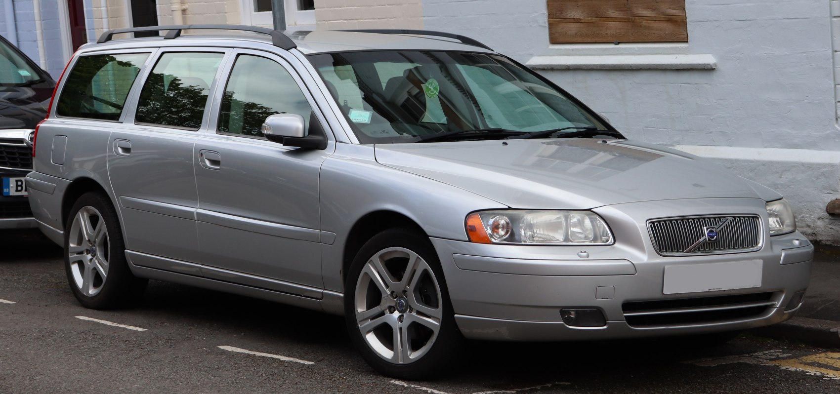 Silver station wagon with alloy wheels, seen from front-side angle