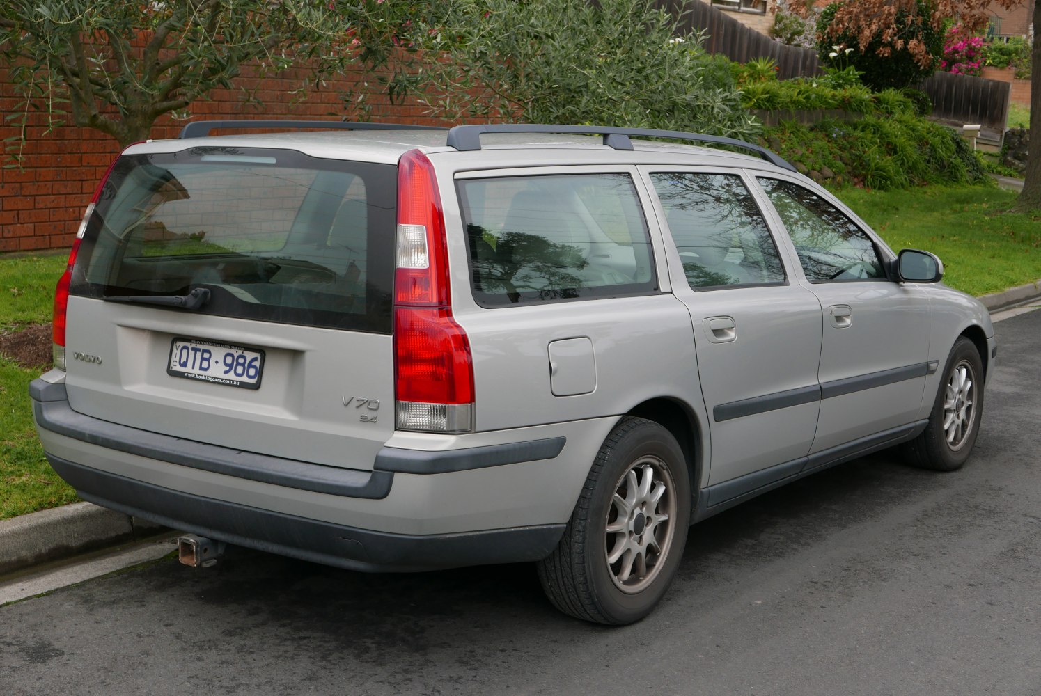 Silver station wagon with roof rails and rear design details