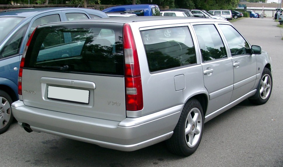 Silver station wagon rear featuring vertical tail lights and estate design