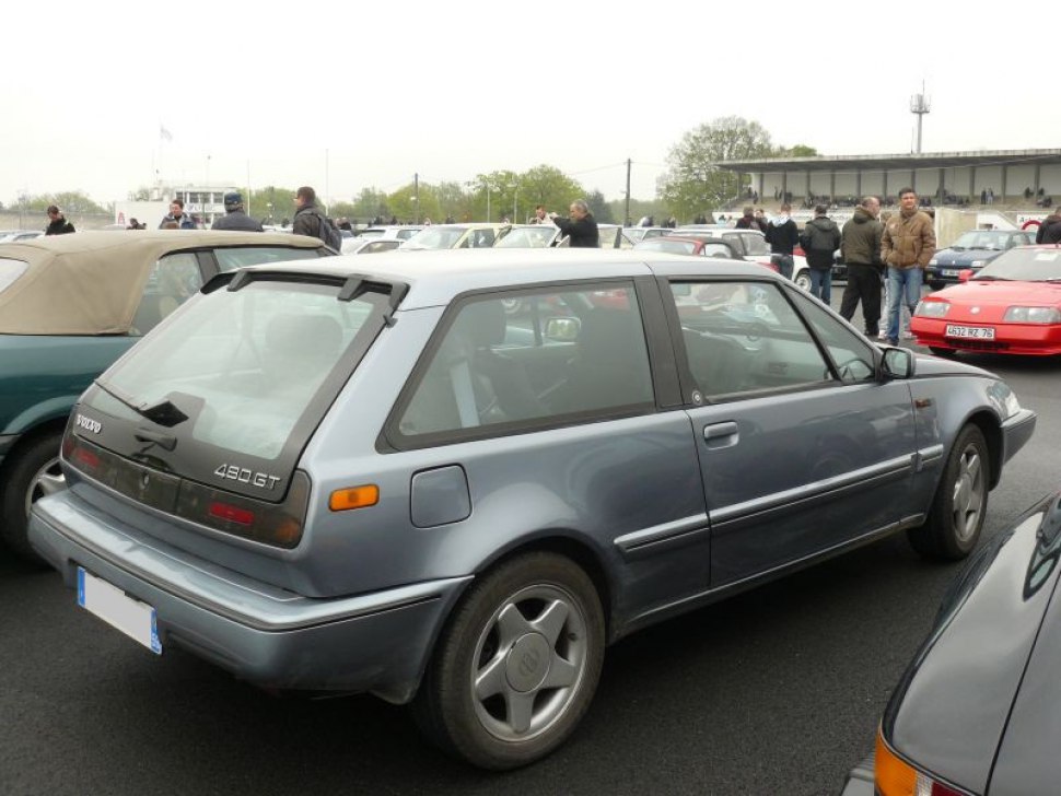 Angular three-door hatchback with rear spoiler and distinctive rear window