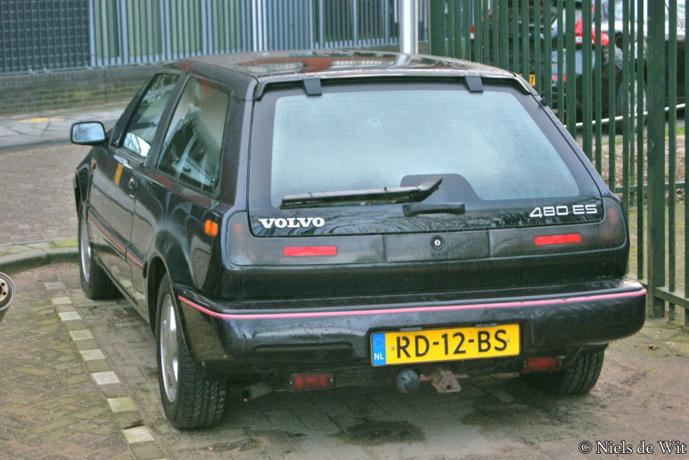 Rear hatchback view with distinctive tail lights and rear window wiper