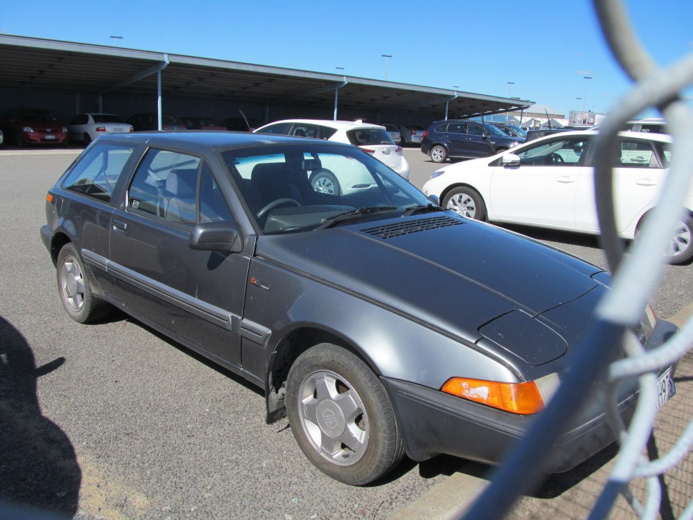 1980s hatchback with pop-up headlights and angular body design.