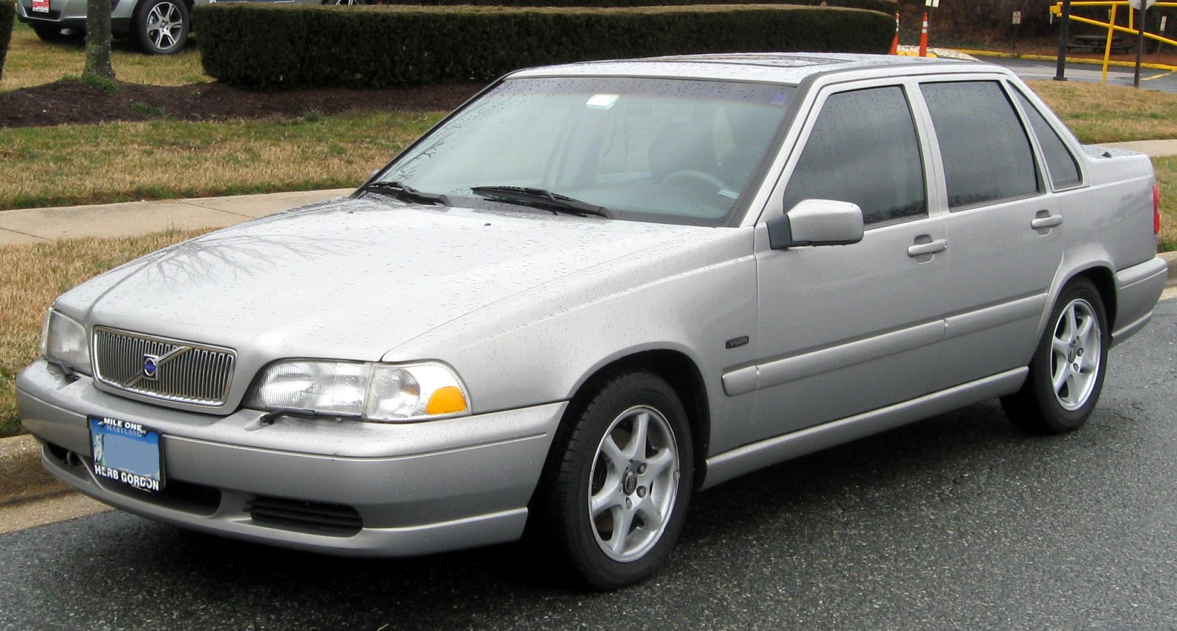 Silver sedan with classic front grille and alloy wheels