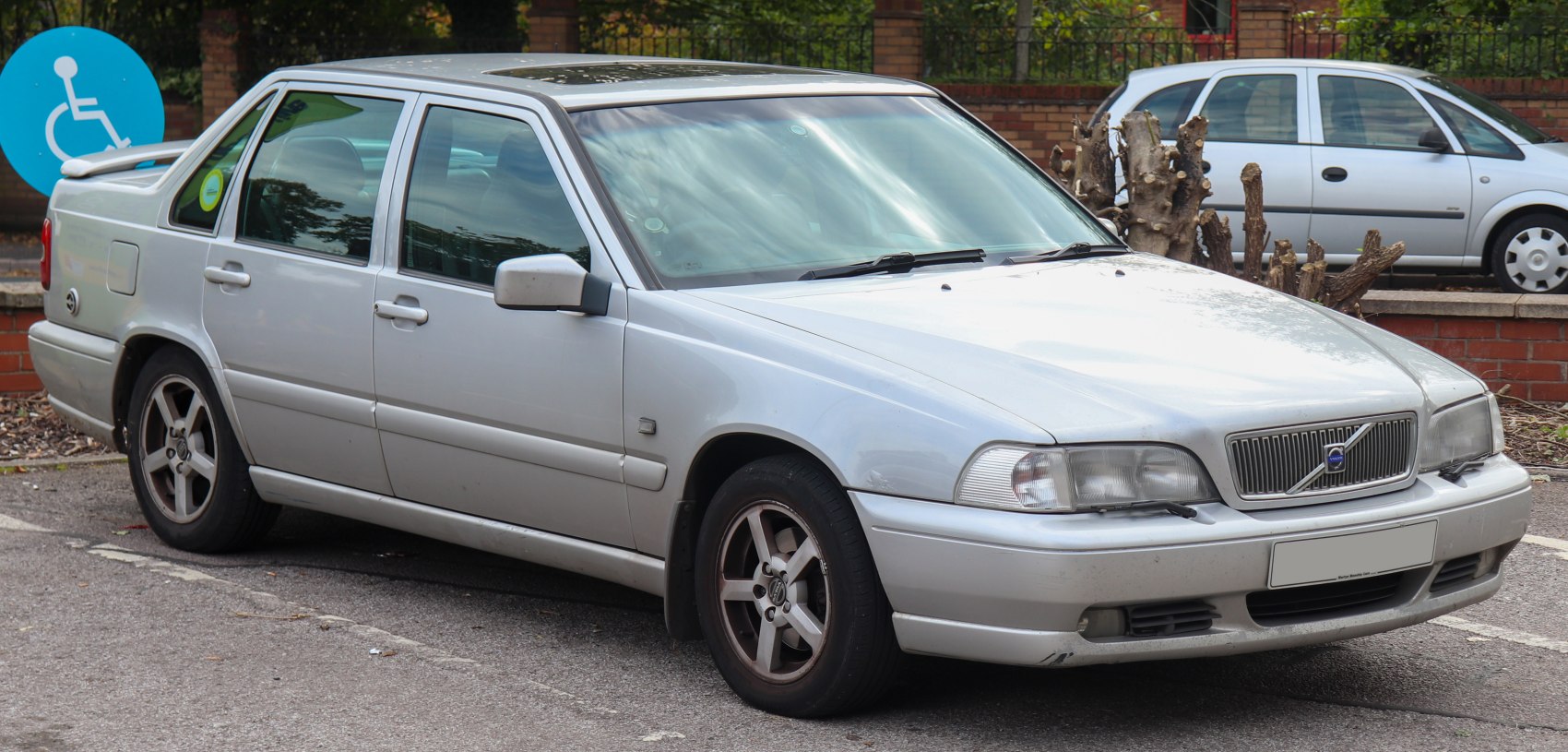 Front side view of a silver sedan with alloy wheels