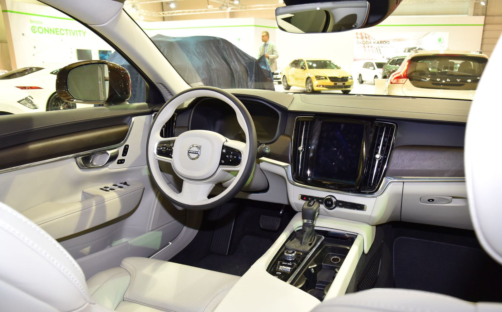 Modern dashboard and steering wheel layout with gear shift and touchscreen