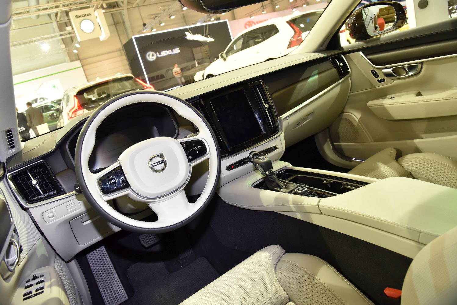 Luxury beige interior with steering wheel and dashboard