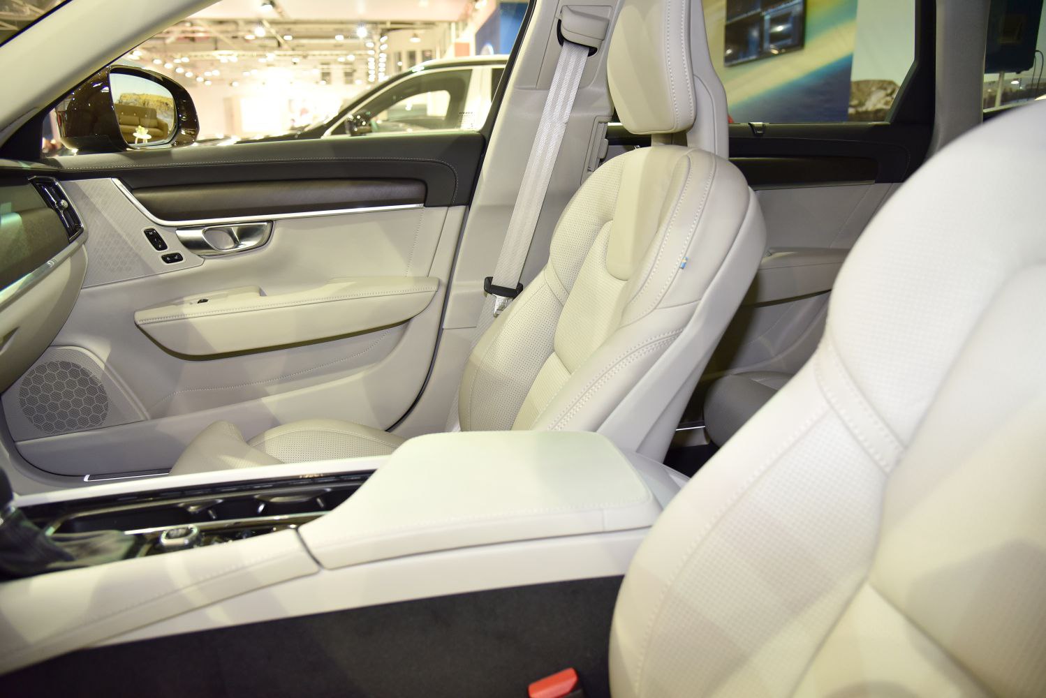 Beige leather front seats and door panel with integrated controls