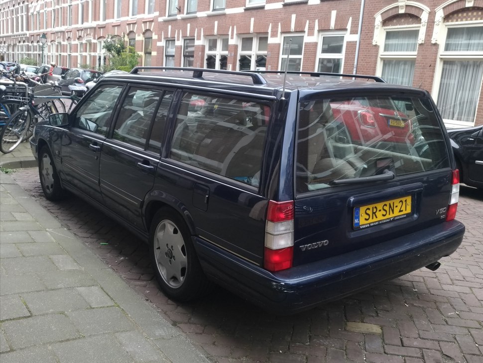 Rear view of classic angular station wagon with spacious cargo area and roof rails