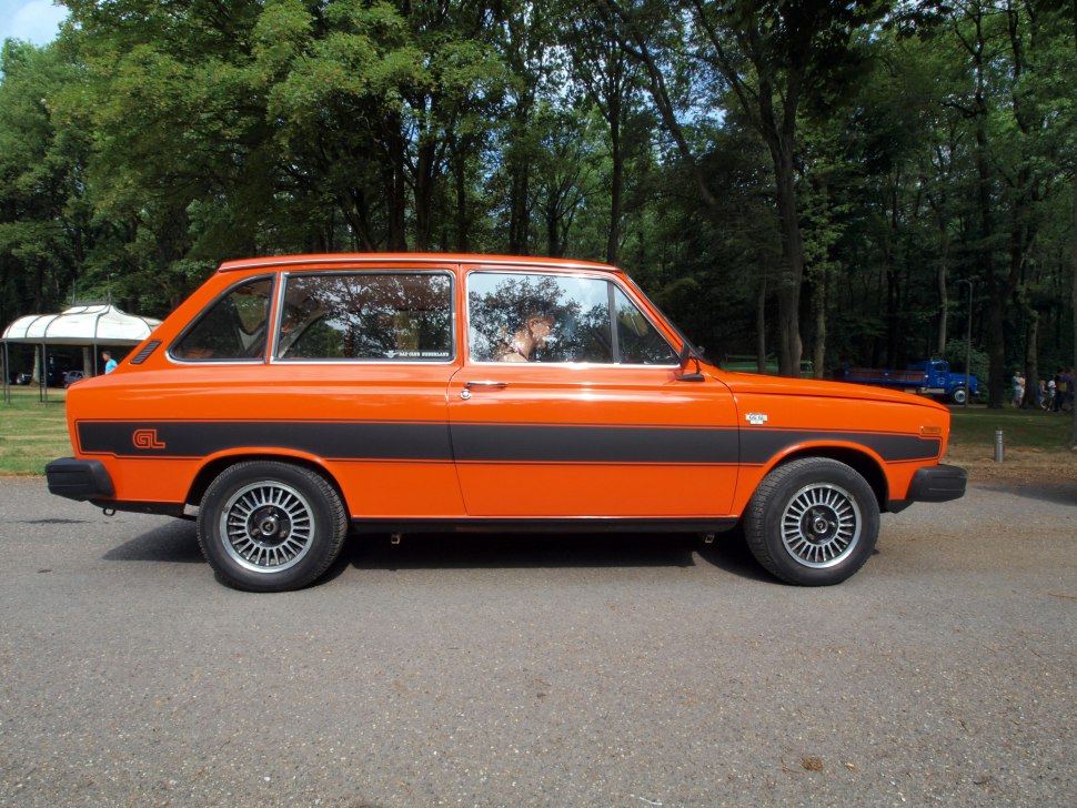 Classic two-door compact station wagon with black side stripes