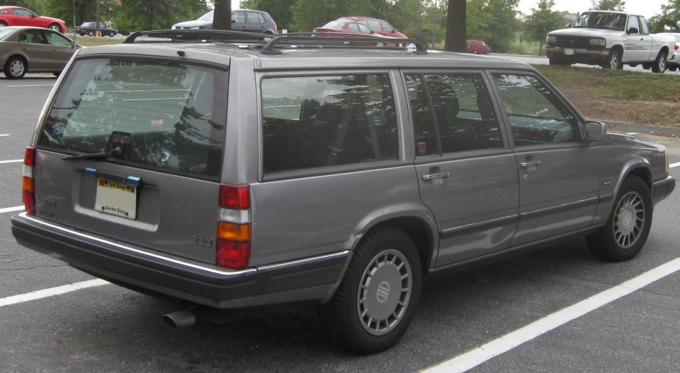 Rear-side view of a classic station wagon with roof rails and distinct tail lights.