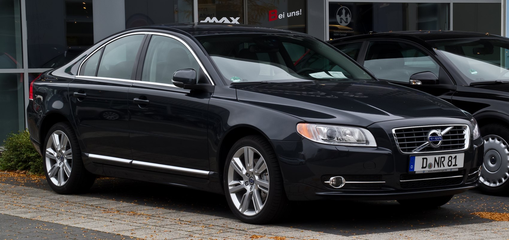 Luxury sedan with chrome trims, sharp headlights, and alloy wheels.