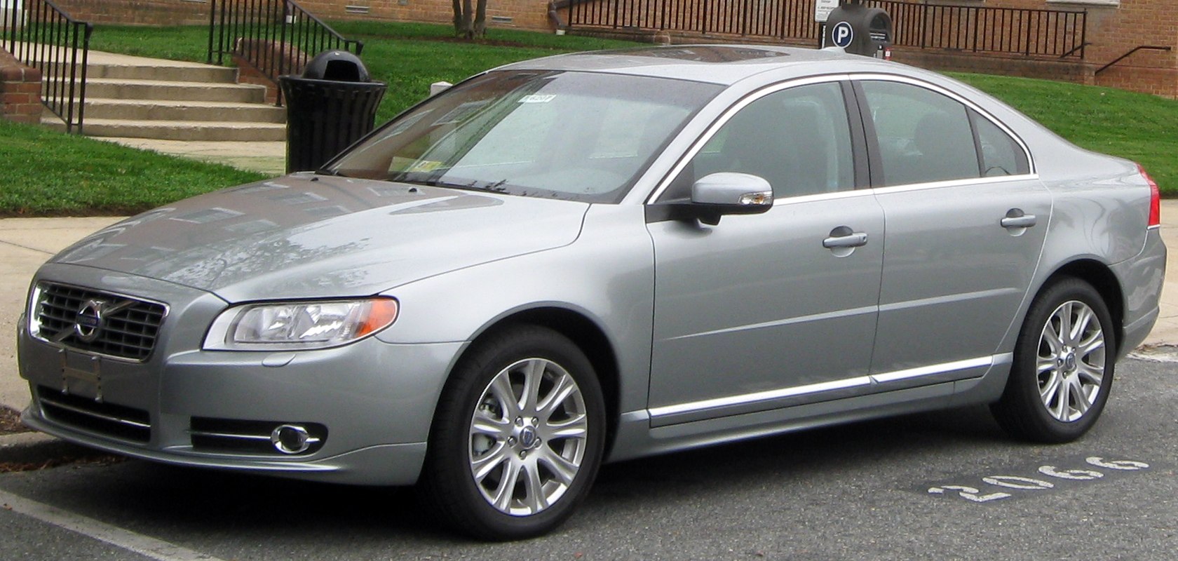 Silver sedan with chrome trim and alloy wheels in front side view