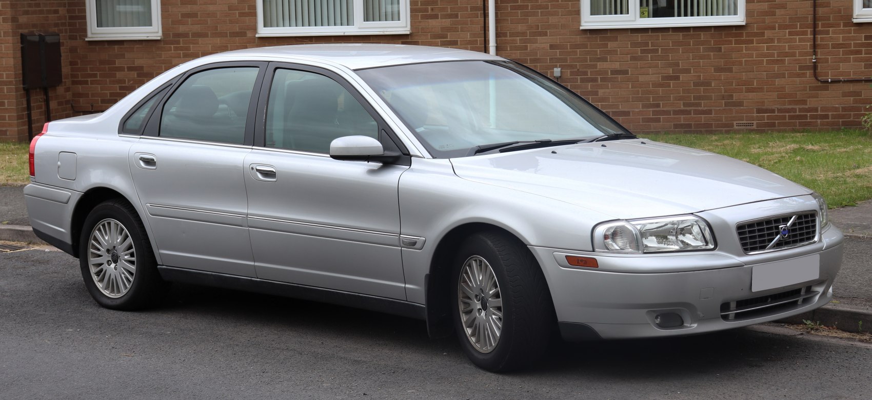 Silver luxury sedan with distinctive front headlights and alloy wheels