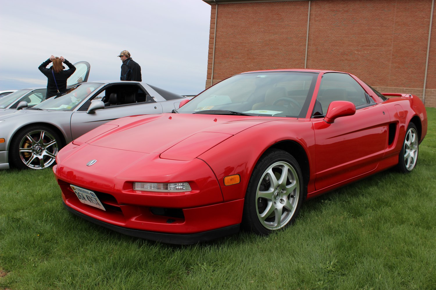 Pop-up headlights and removable targa roof on a sleek sports coupe