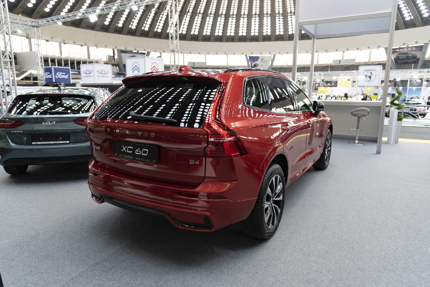 Rear view of a red SUV showing distinct modern tail lights and rear design.