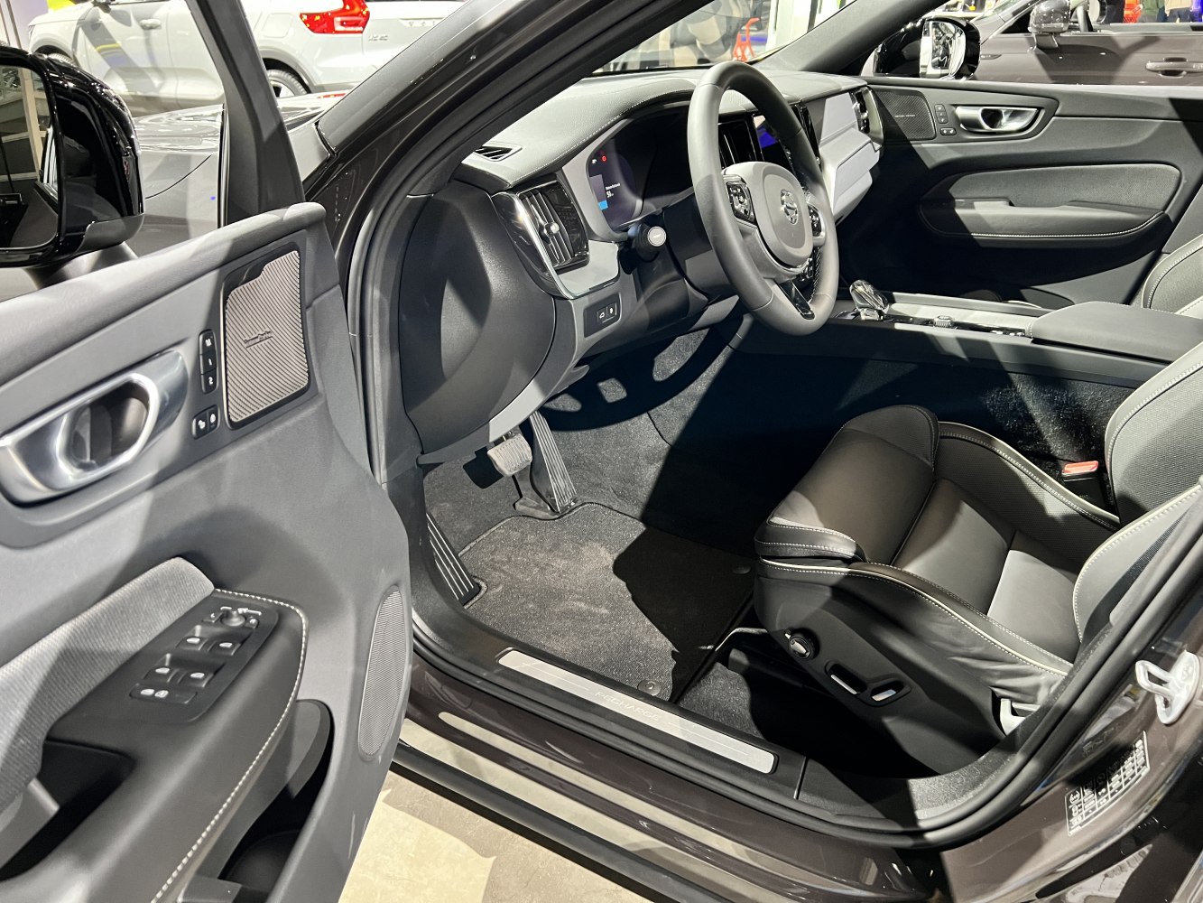 Modern dashboard, steering wheel, and front driver's seat interior