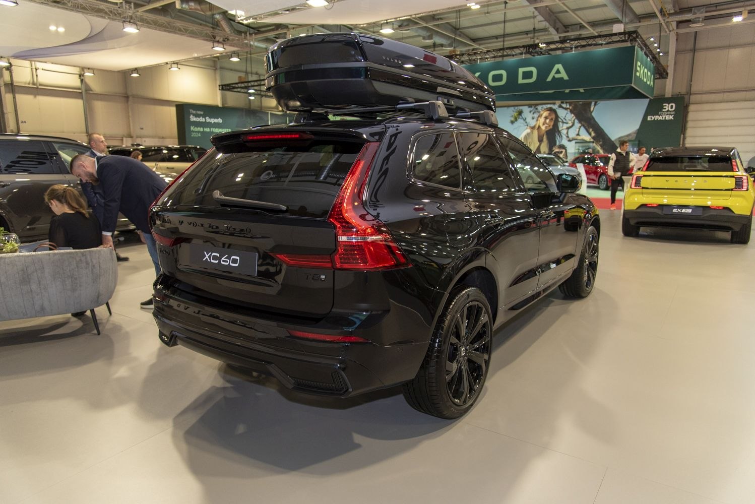 Black SUV rear view with roof cargo box and distinct vertical taillights
