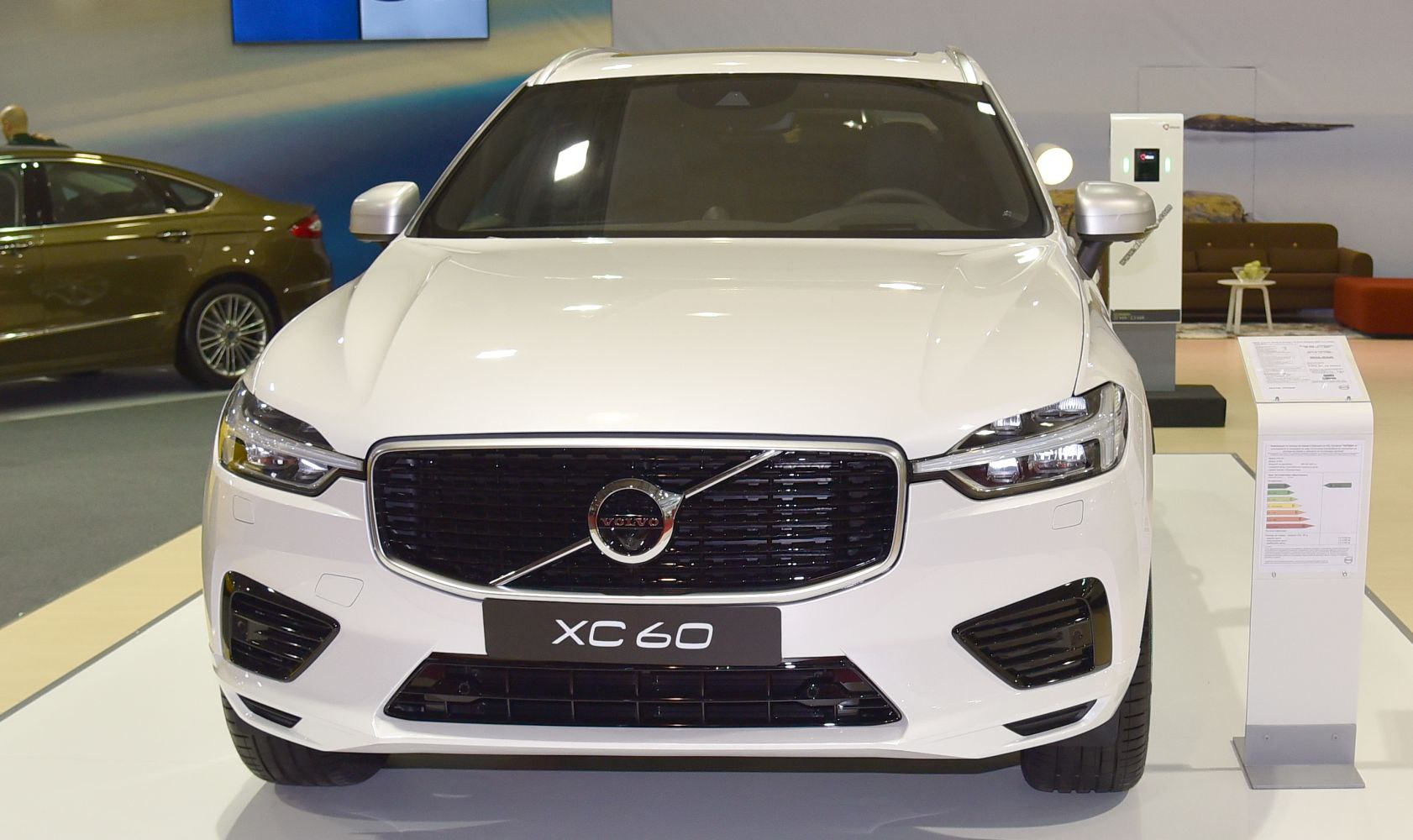 Front view of white SUV with bold black grille and LED headlights