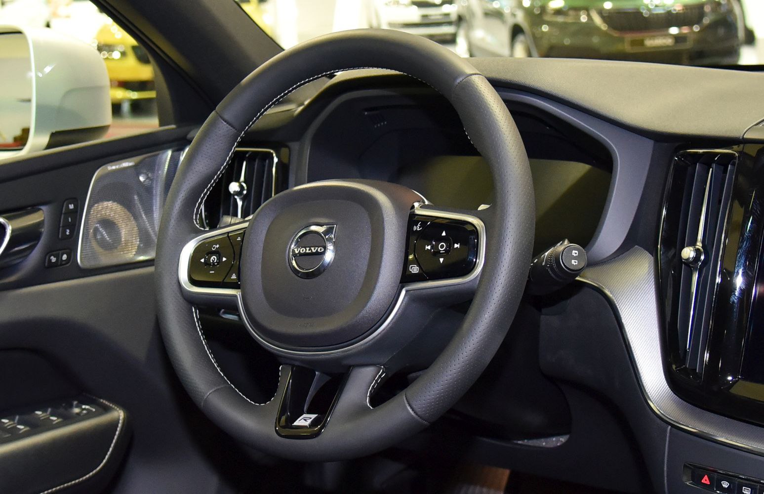 Volvo car interior with steering wheel and dashboard controls