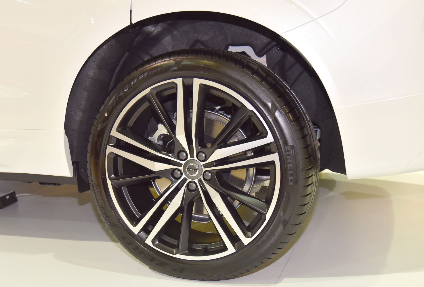 Multi-spoke alloy wheel with Pirelli tire close-up