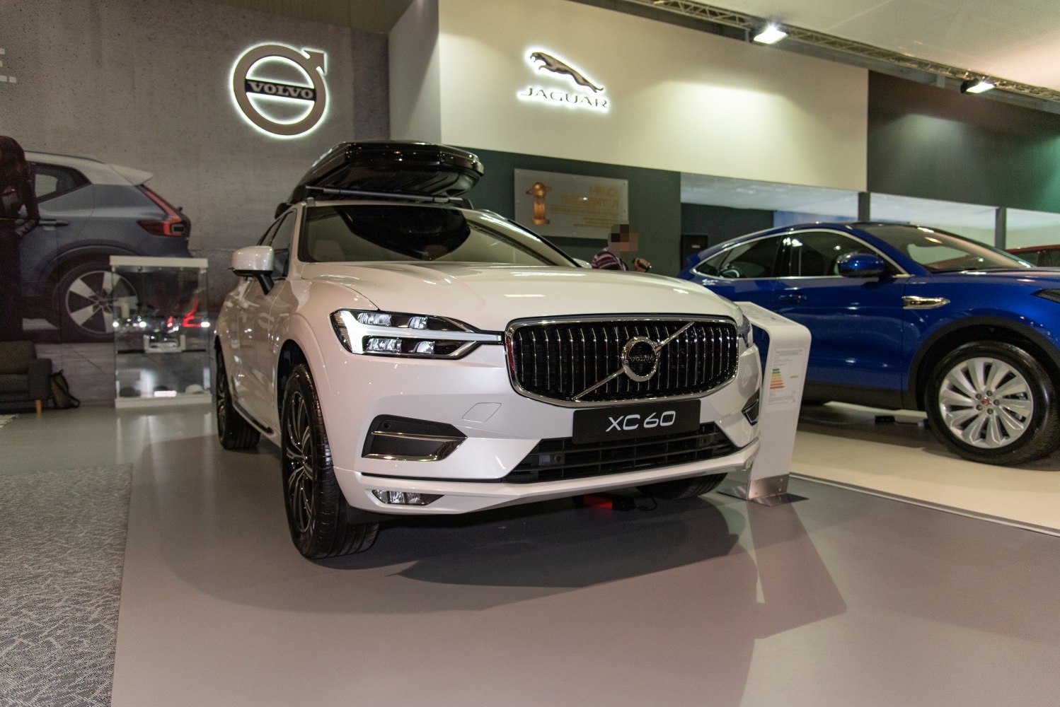 Front view of premium luxury SUV with roof cargo box