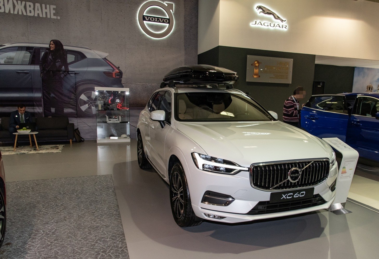 SUV with roof box and modern LED headlights