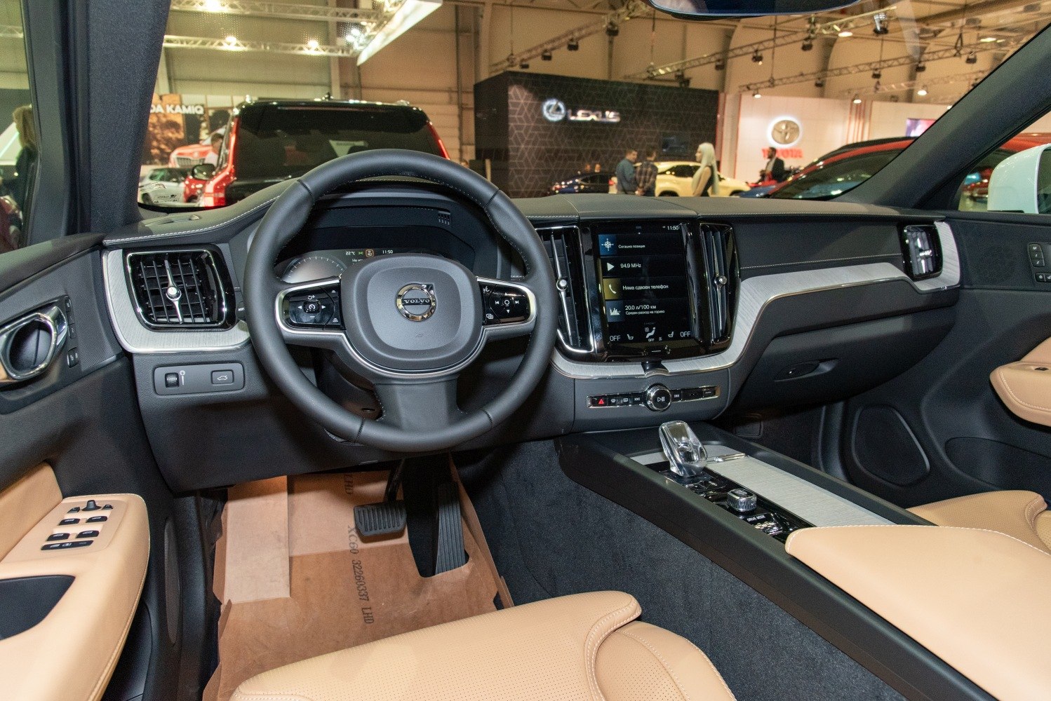 Dashboard and steering wheel with touchscreen and beige seats
