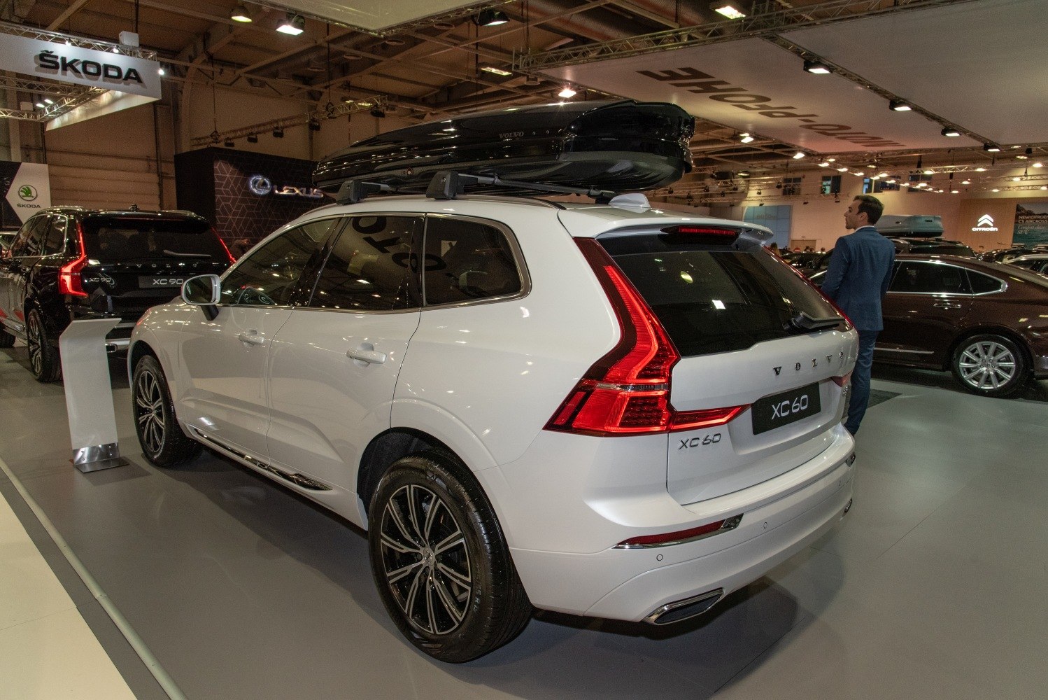 Rear view of SUV with roof cargo box and distinctive taillights