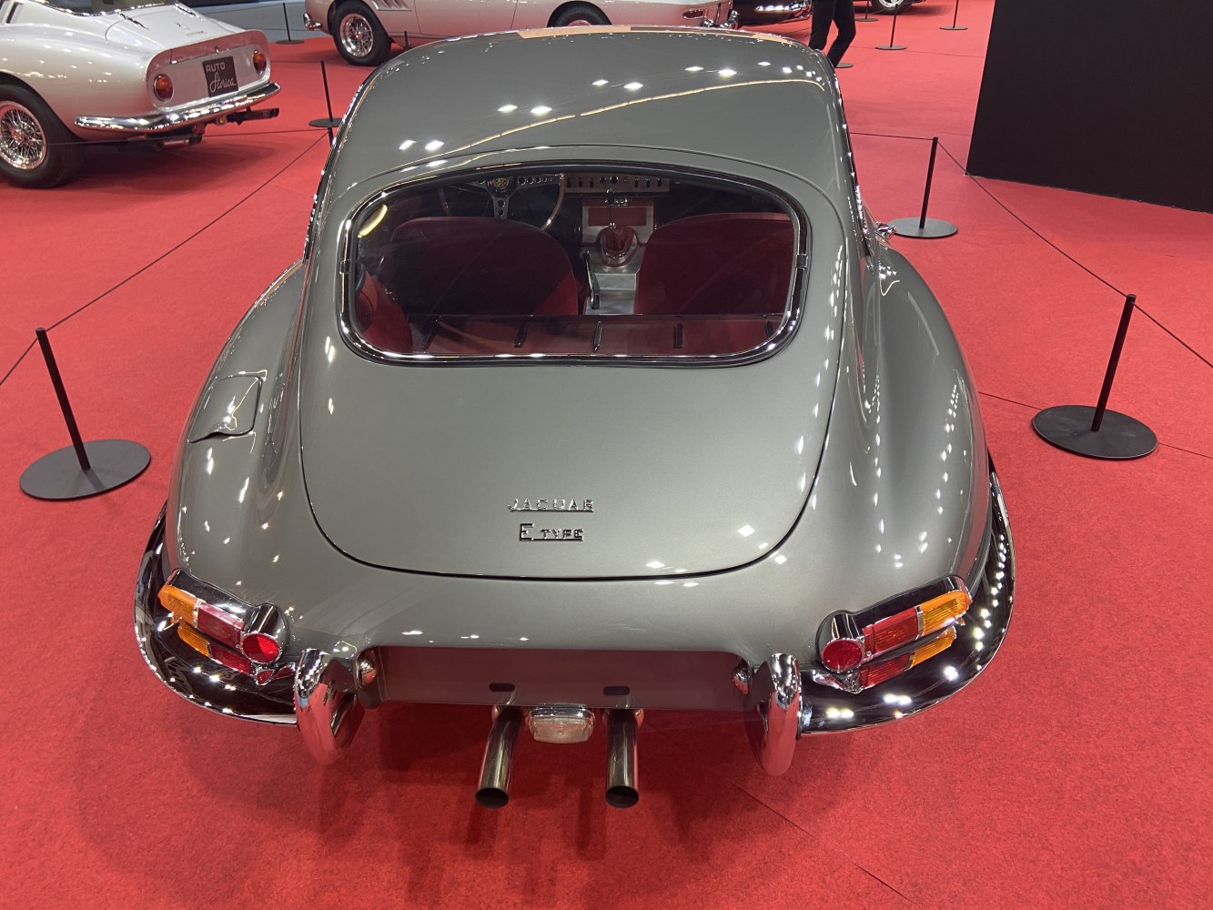 Rounded rear with dual exhausts and distinctive tail lights.