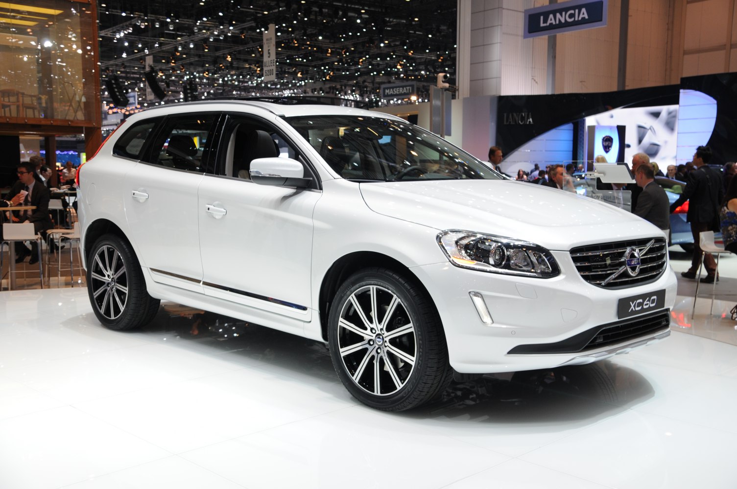 White SUV with alloy wheels, front-side view