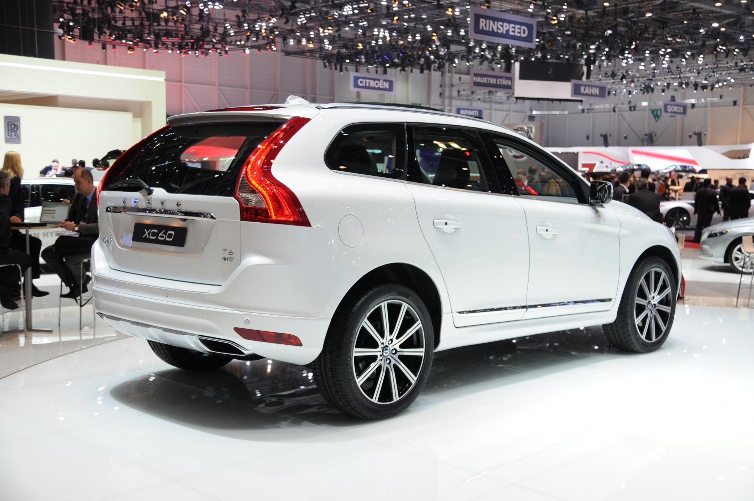 Rear and side view of white SUV with distinctive taillights and alloy wheels