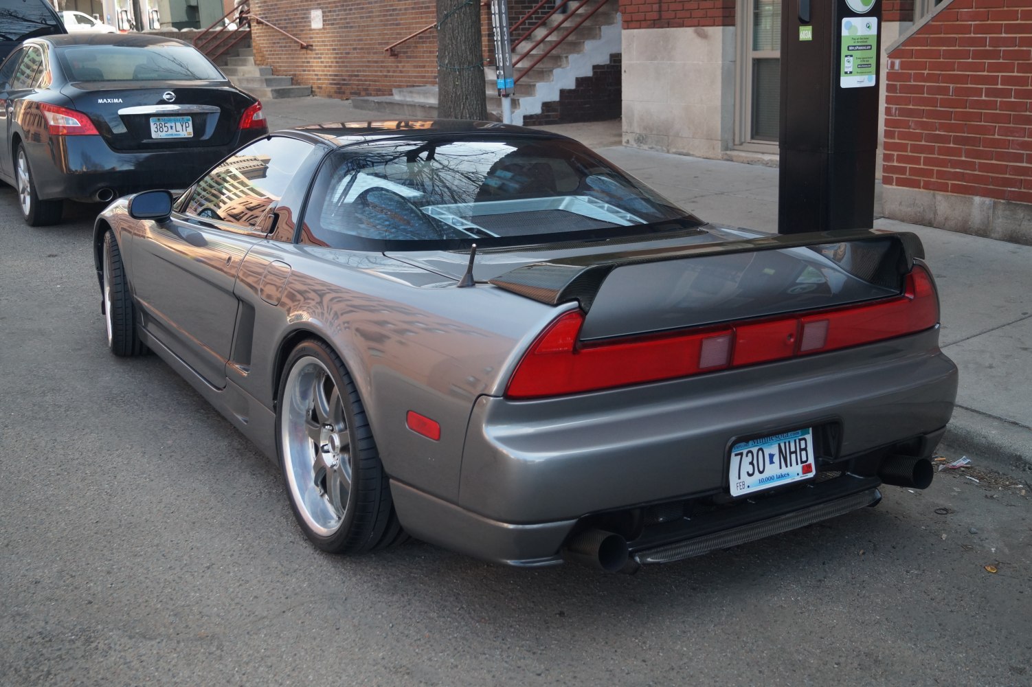 Rear spoiler and glass engine cover of a classic sportscar