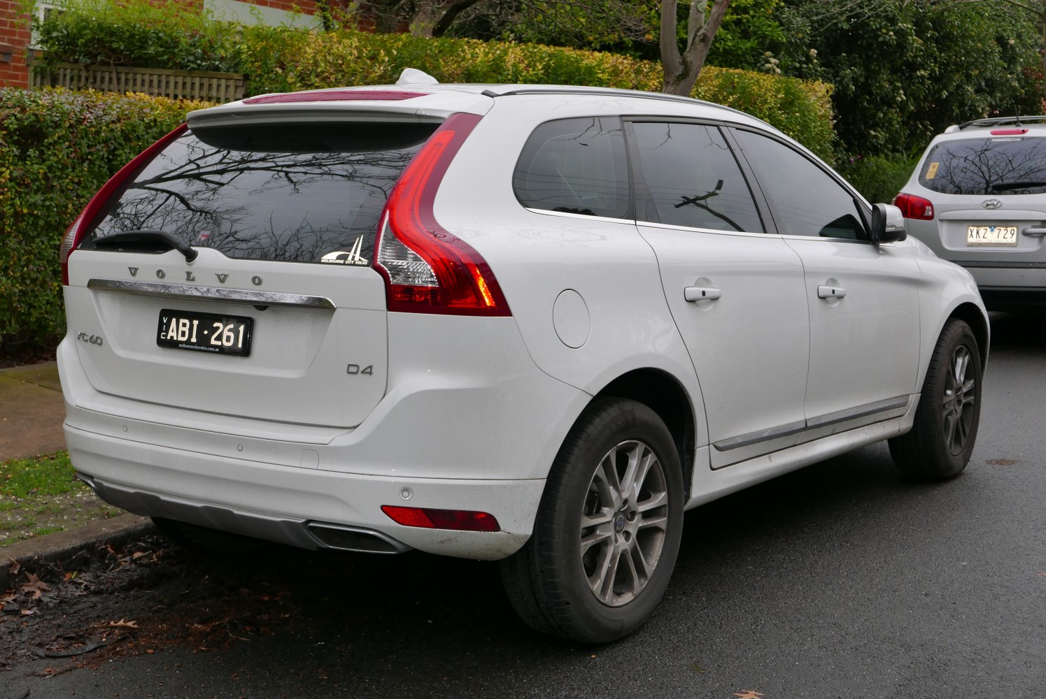 Rear view with distinctive L-shaped taillights and rear wiper