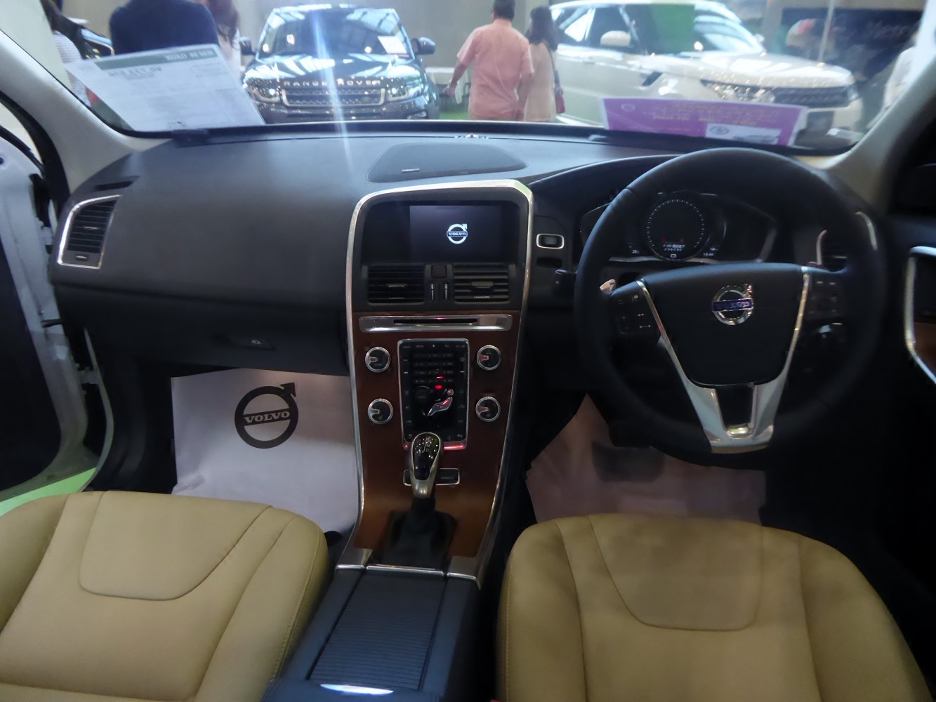 Vehicle interior with dashboard, steering wheel, and central control console.