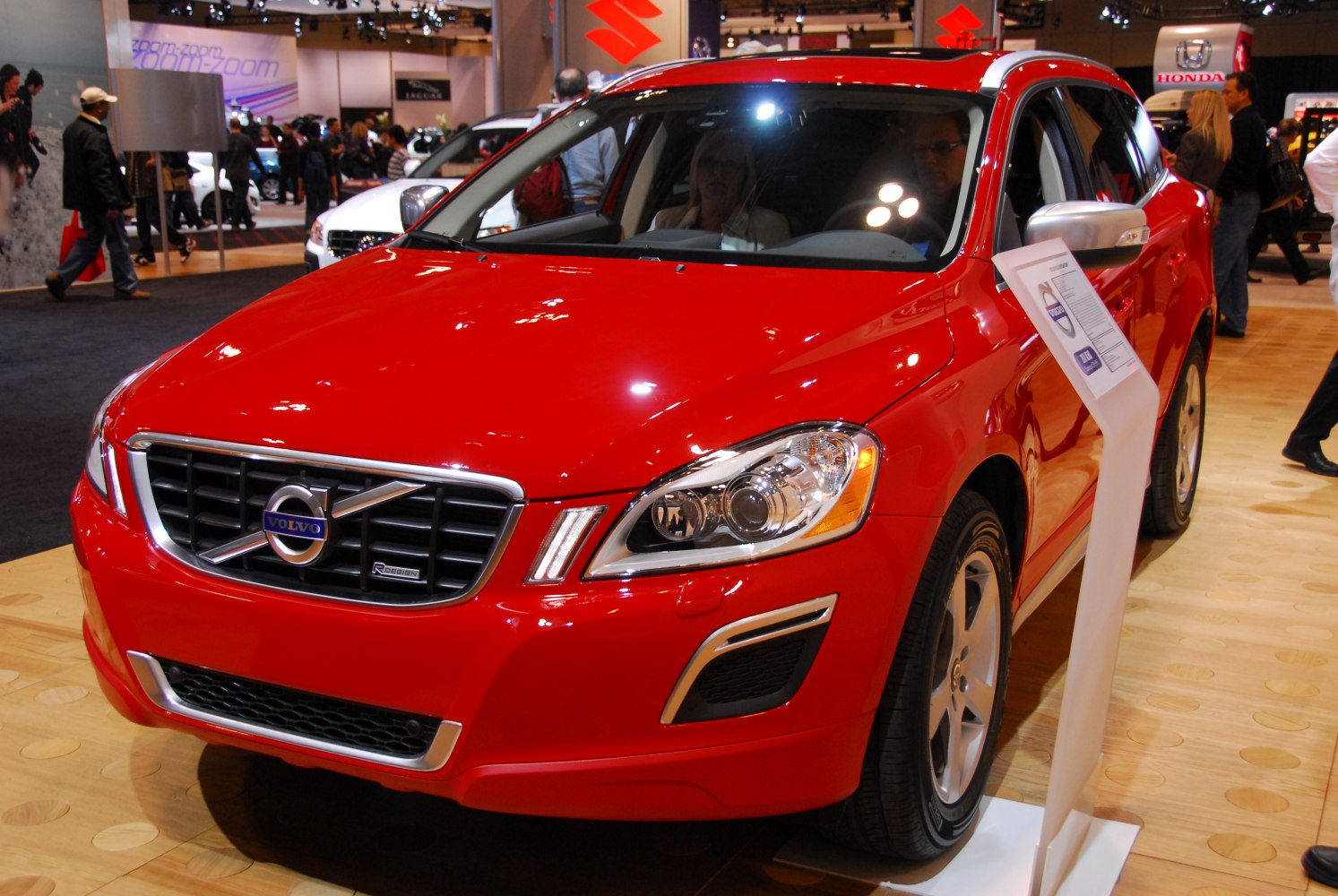 Front view of red SUV with prominent grille and LED headlights